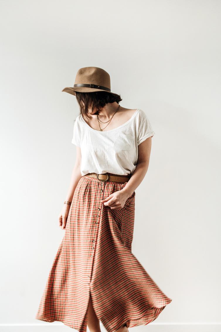 Women's Relaxed Fashion Against Wall