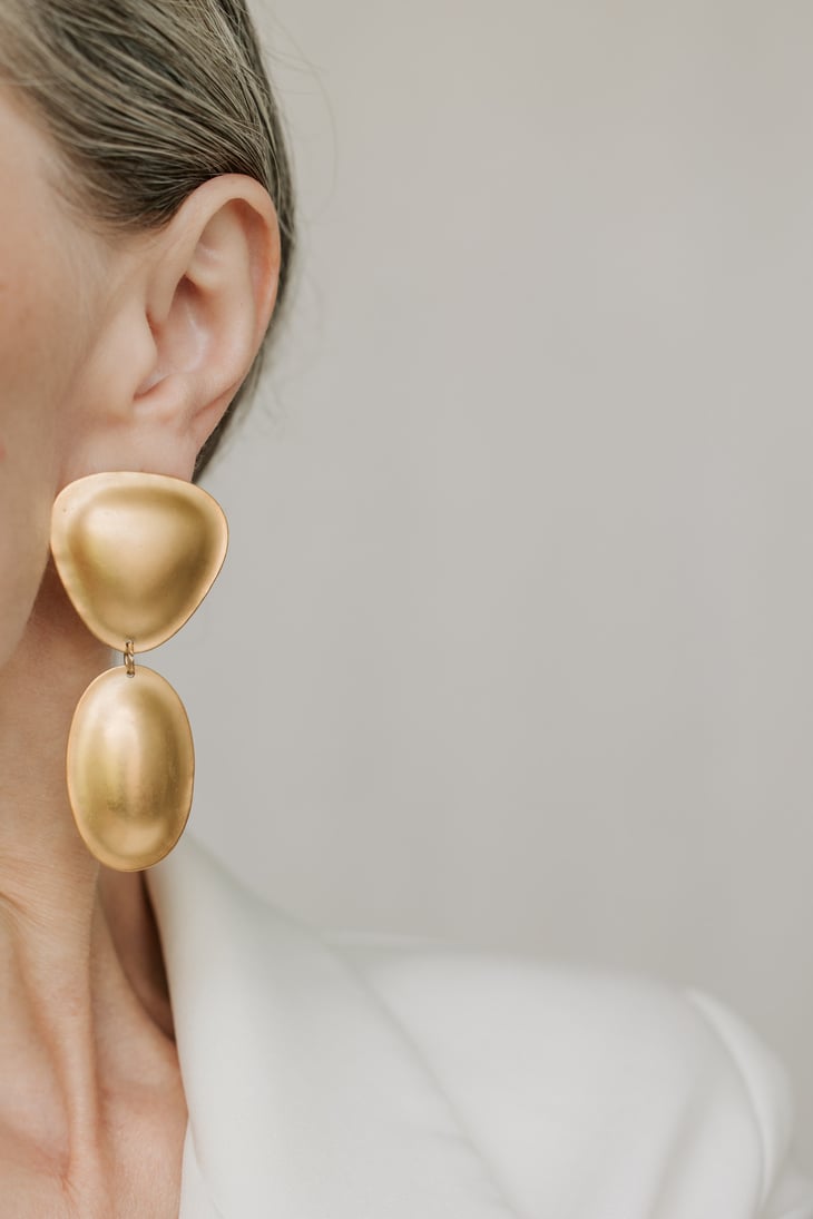 Woman Wearing Gold Earring